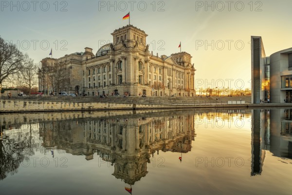 the famous reichstag building in berlin while sunset