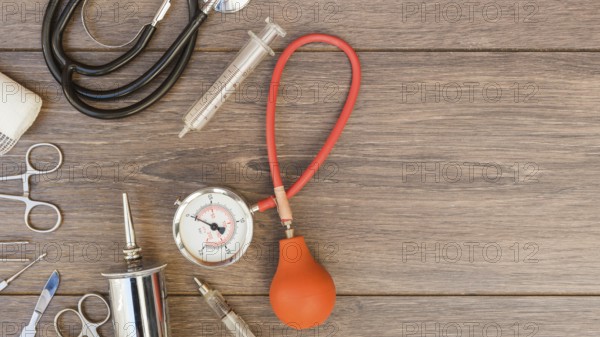 Sphygmomanometer stethoscope medical equipment s wooden desk