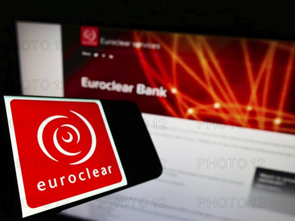 Stuttgart, Germany, 01-06-2022: Cellphone with logo of Belgian financial company Euroclear Group on screen in front of business website. Focus on center-left of phone display, Europe