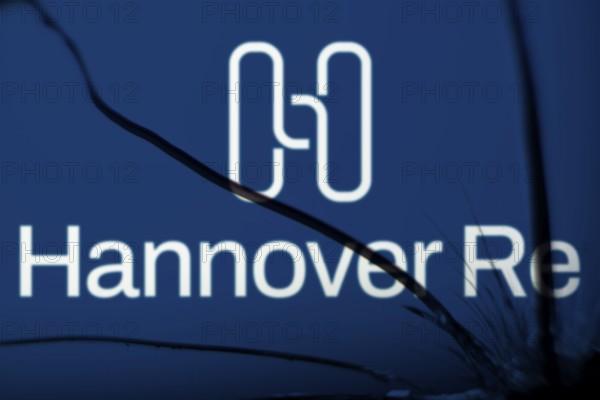 Hannover re logo is visible on the broken glass. Hannover Re is a reinsurance company