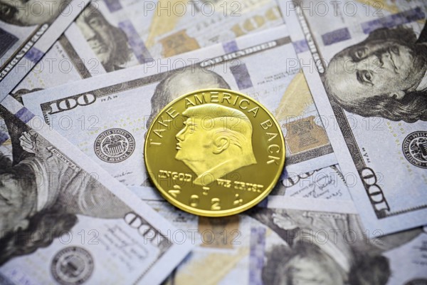 Donald Trump coin as 47th President of the USA on dollar bills, symbolic photo of presidency and US politics