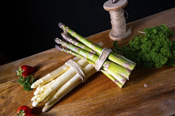 Green and white asparagus on the table