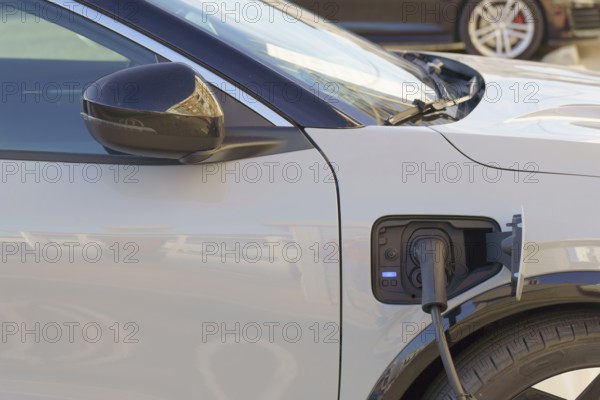 Ronda, malaga, spain, White electric car charging its battery in a charging station