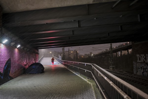 Germany, Berlin, 05.01.2025, subway Behmbrücke, tent of a homeless person, bicycle courier, Europe
