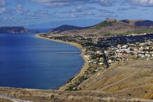 View from the viewpoint, Vila Baleira village, Miradouro Portella 162 m, sandy beach, Madeira Island horizon, Atlantic Ocean, Porto Santo Island