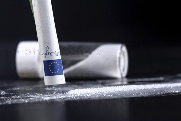 Cocaine Sniffing Closeup, Rolled Banknote for Snorting Line of Cocaine, Cocaine Drug Addiction