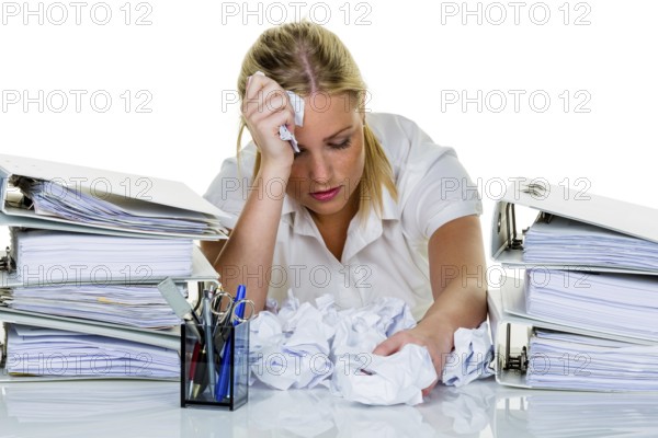 Young woman in the office is overwhelmed with work. burnout syndrome at work or study. Austria