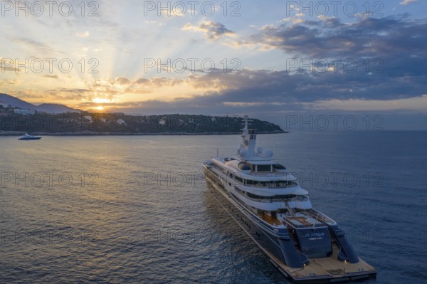 Aerial view of 133 metre motor yacht AL MIRQAB, delivered in 2008 by the German shipyard Kusch Yachts, Peters Schiffbau to Sheikh Hamad bin Jassim bin Jaber bin Muhammad Al Thani, member of the royal family of Qatar, designer Tim Heywood, early in the morning at anchor off the Principality of Monaco, Cote d'Azur, Mediterranean Sea