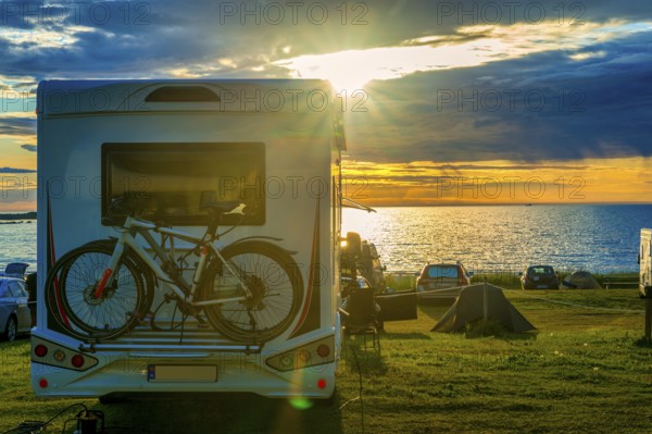 Motorhome, standing, meadow, Atlantic Ocean, sunset, midnight sun, backlight, beach, Lofoten, Norway, public area, Europe