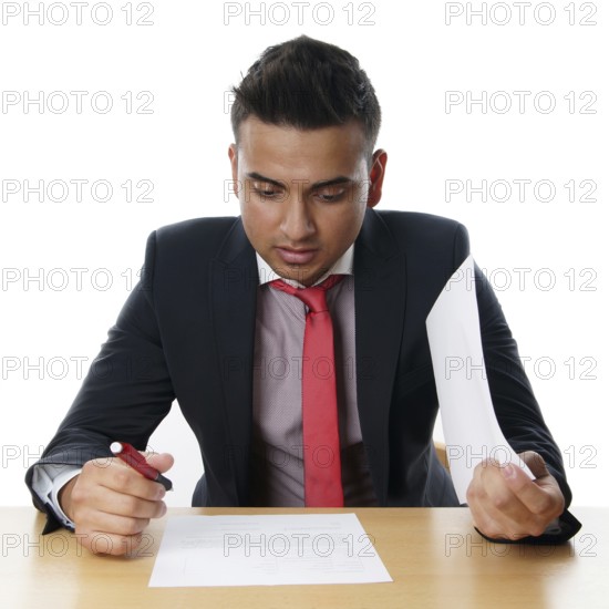 Man reads contract at his desk