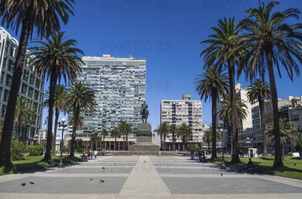 MONTEVIDEO, URUGUAY, Dezember 25, 2016: Monument to José Artigas, Plaza Independencia, famous town squareIew of the sea from Punta Ballena in Punta del Este Uruguay, boat passing by the image