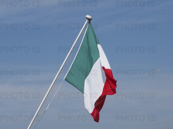 Italian Flag of Italy over blue sky