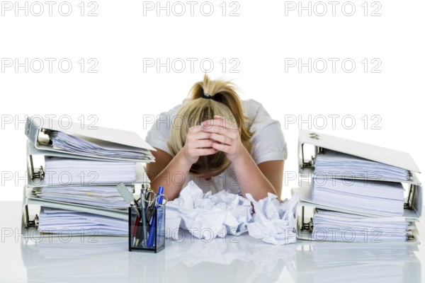Young woman in the office is overwhelmed with work. burnout syndrome at work or study. Austria