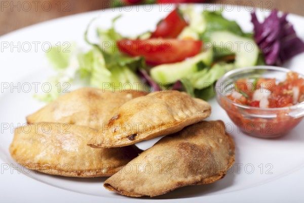 Homemade empanadas with salsa