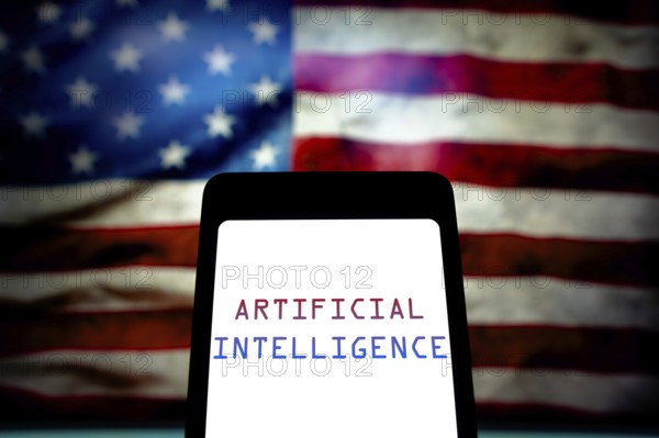 May 21, 2024, Brazil. In this photo illustration, the Artificial Intelligence (AI) text is displayed on a smartphone screen and in the background, the flag of the United States. The United States government has issued an executive order that aims to control and regulate the risks posed by artificial intelligence technologies