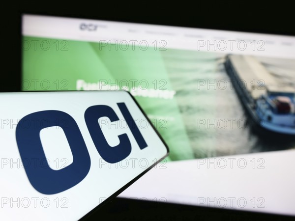 Stuttgart, Germany, 07-22-2023: Smartphone with logo of Dutch chemical company OCI NV on screen in front of business website. Focus on center of phone display, Europe