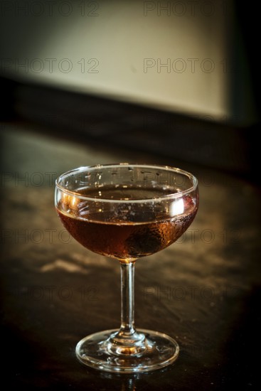 Manhattan classic whisky cocktail drink in modern bar