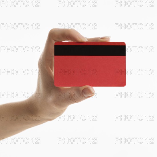 Front view hand holding credit card. High resolution photo