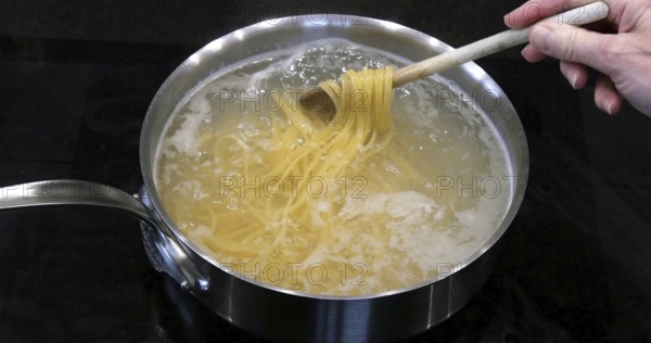 Hot Boiling Water and Spaghetti Pasta in a saucepan
