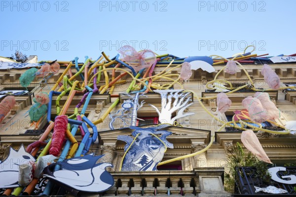 Artistically designed façade on historic city building in Paris, Rue de Rivoli