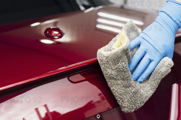 Close up person cleaning car exterior. Resolution and high quality beautiful photo