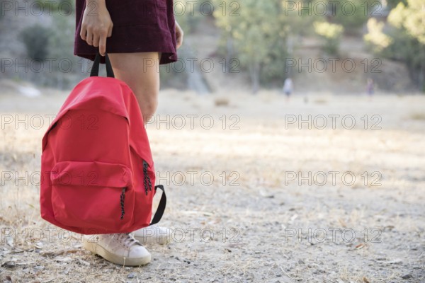teenager waiting with backpack hand park. Beautiful photo