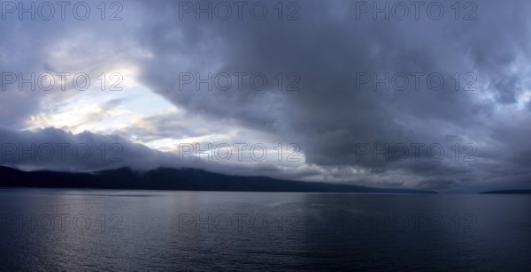 Storm clouds by the sea over the island of Cres, panoramic shot, Kvarner Bay, Croatia, Europe