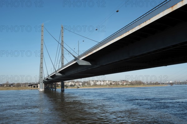 View over the Rhine with Rheinkniebrücke, behind it Oberkassel, Düsseldorf, Germany, Europe