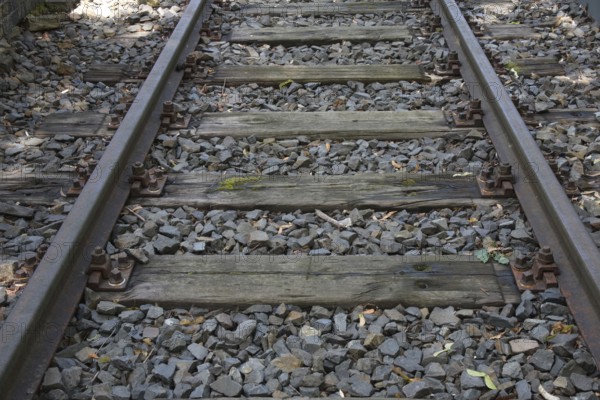 Rails with old wooden sleepers as part of the Gleis 17 memorial site, former Grunewald goods station, Charlottenburg-Wilmersdorf district, Berlin, Germany, Europe
