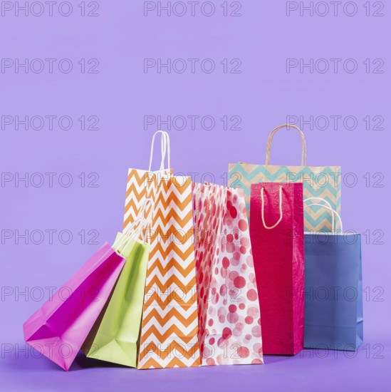 Colorful empty shopping bags purple background. Resolution and high quality beautiful photo