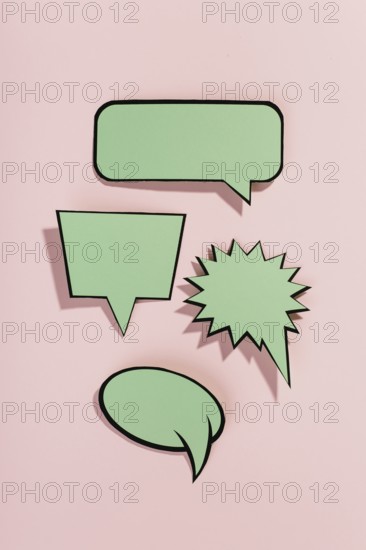 Green speech bubbles with black border pink background