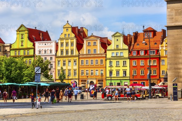 Wroclaw, Poland, June 21, 2019: View of Old town Salt Square colorful houses, flower stalls and people, Europe