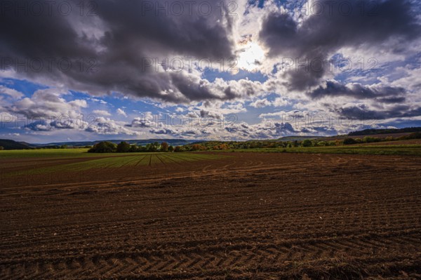 View over the fields of Dornburg towards Jena in autumn with thick rain clouds, Dornburg, Thuringia, Germany, Europe