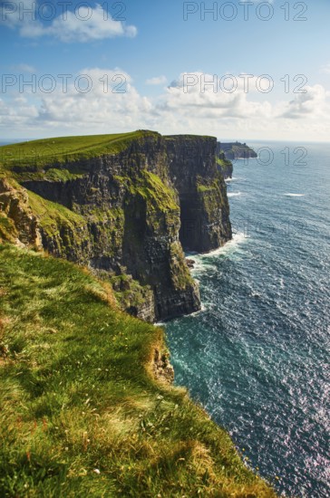 Cliffs of moher in county Clare, Ireland. One of the most popular tourist destinations. Sunny summer day