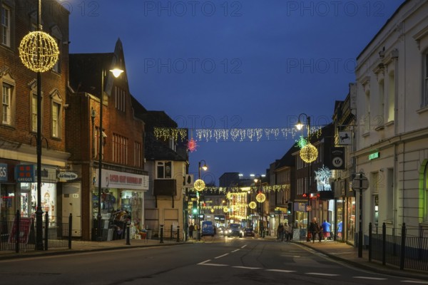 EAST GRINSTEAD, WEST SUSSEX, UK - DECEMBER 16 : Christmas decorations and lights in East Grinstead, West Sussex on December 16, 2021. Unidentified people