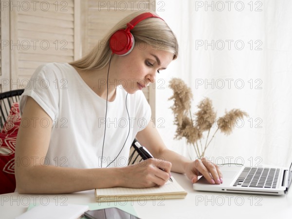 Student wearing red headphones e learning concept