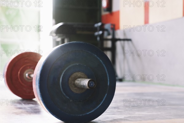 Bodybuilding concept with barbell gym