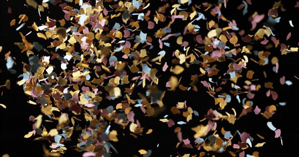 Confettis Falling against Black Background