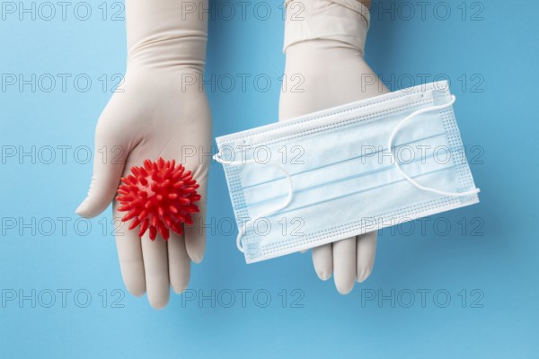 Top view hands holding virus medical mask