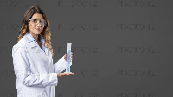Portrait female doctor using hand sanitizer