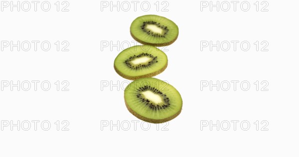 Kiwi (actinidia chinensis), Fruit against White Background