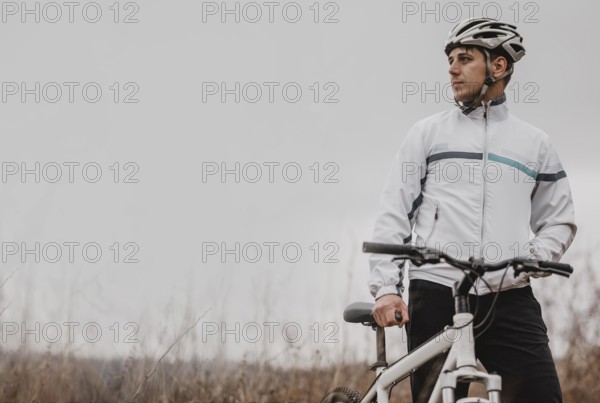 Man riding mountain bike special equipment with copy space