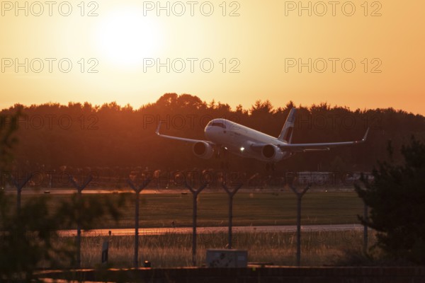 Passenger aircraft Airbus A320neo of the airline Eurowings in the evening glow during approach to Hamburg Airport, Hamburg, Germany, Europe