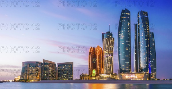 ABU DHABI, UNITED ARAB EMIRATES - FEB 10, 2019: Etihad Towers in Abu Dhabi, United Arab Emirates after sunset
