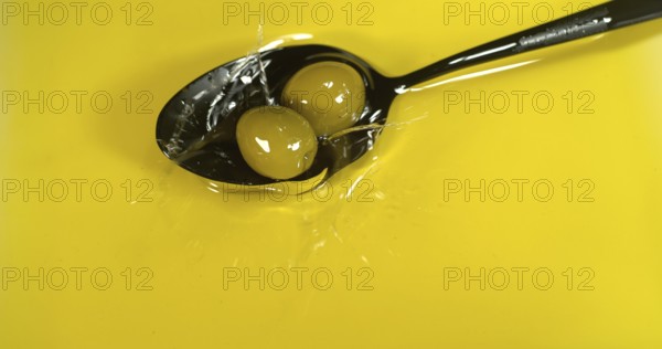 Green Olive, Olea europaea, Falling in a Spoon
