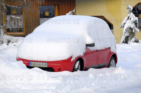 Snowed-in car at the house, car with snow