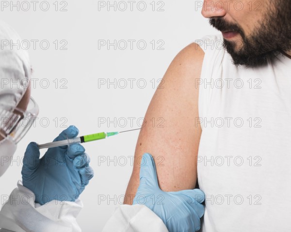 close up bearded man being vaccinated. High resolution photo