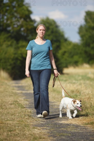 Woman with Parson Russell Terrier on leash, Parson Jack Russell Terrier, dog leash, walking, dog walk, leashed, loose leash