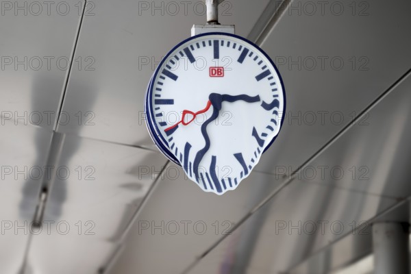 Plattling, Bavaria, Germany, March 10th 2024, train station clock of Bahnhof Plattling with Deutsche Bahn Logo, time is running, Europe