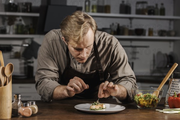 Mid shot chef plating dish